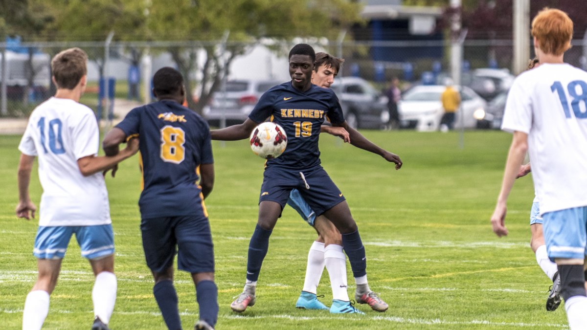 Kennedy boys soccer players during gameplay