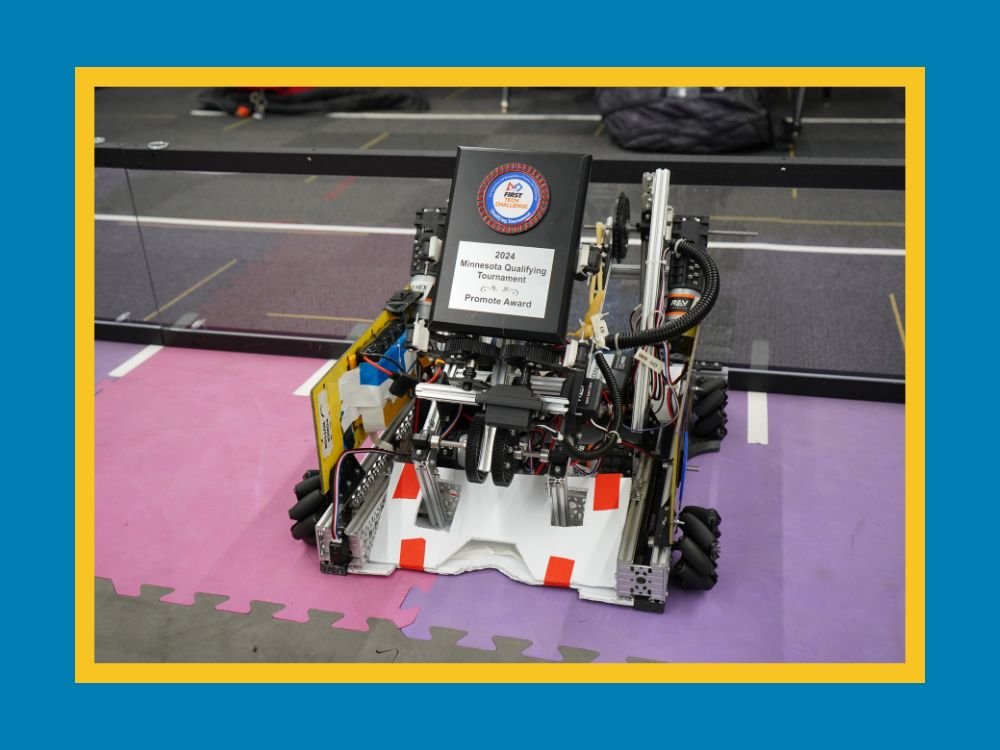 robot holding an award plaque