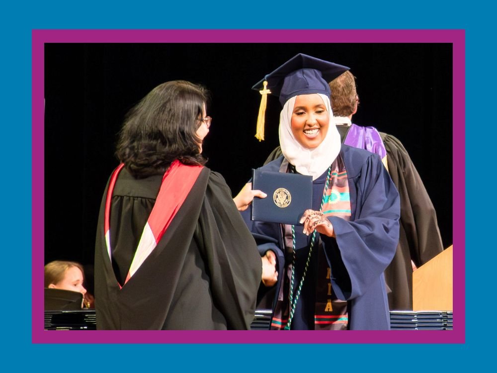 Kennedy High School graduate receiving diploma