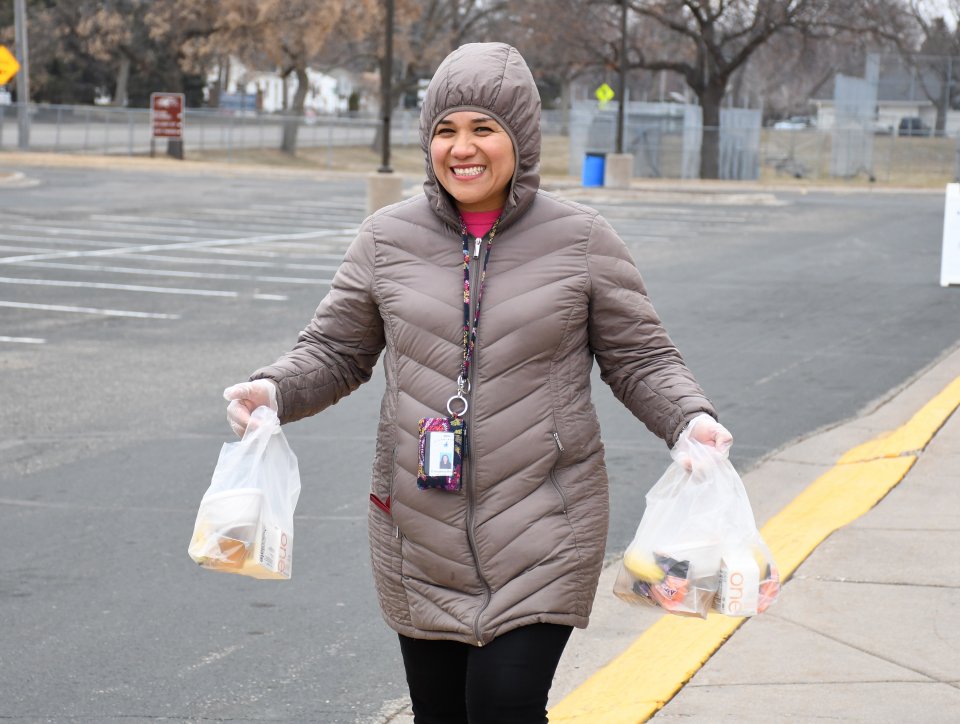 Woman carrying food bags