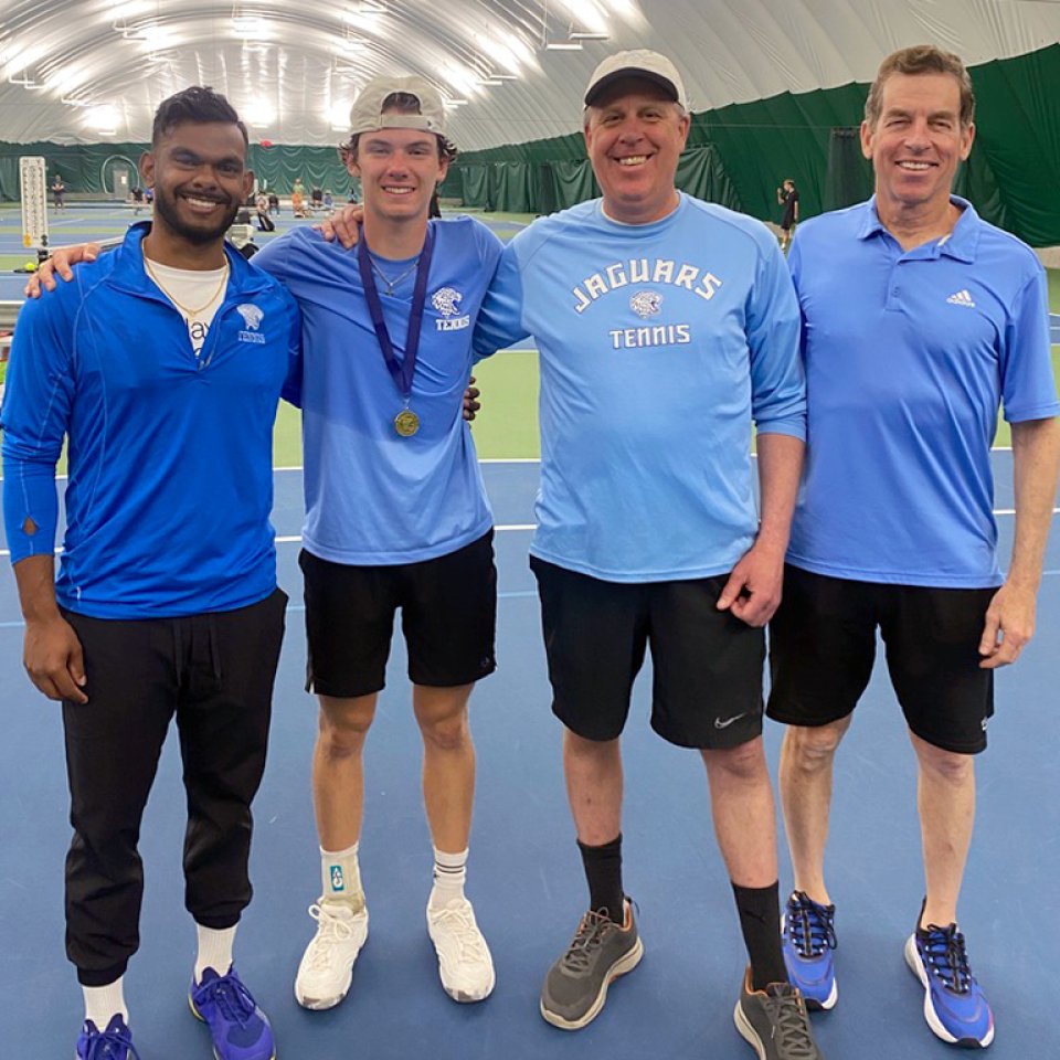 Bode Campbell and coaches after section championship win