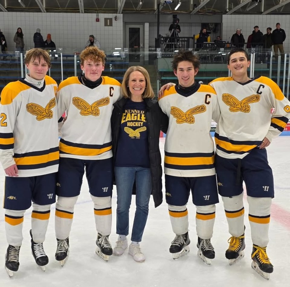 hockey players with school principal