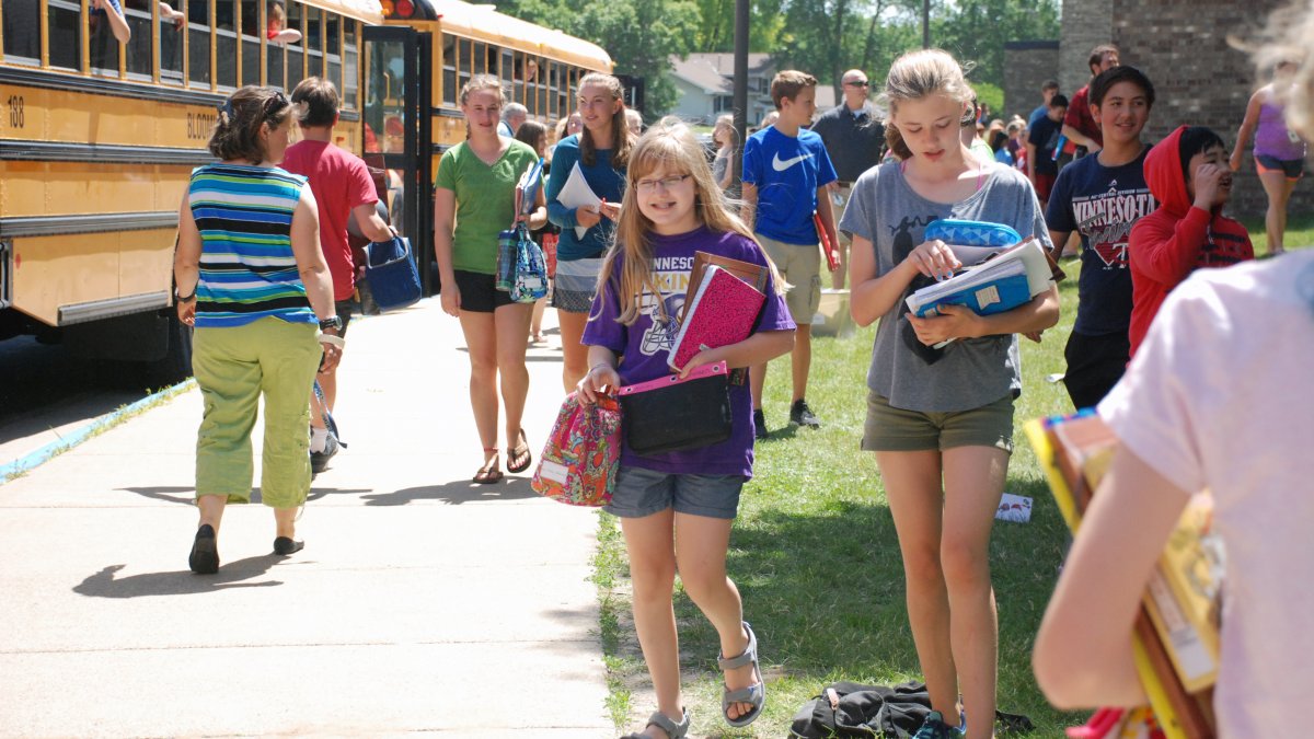 Students head to the buses after school