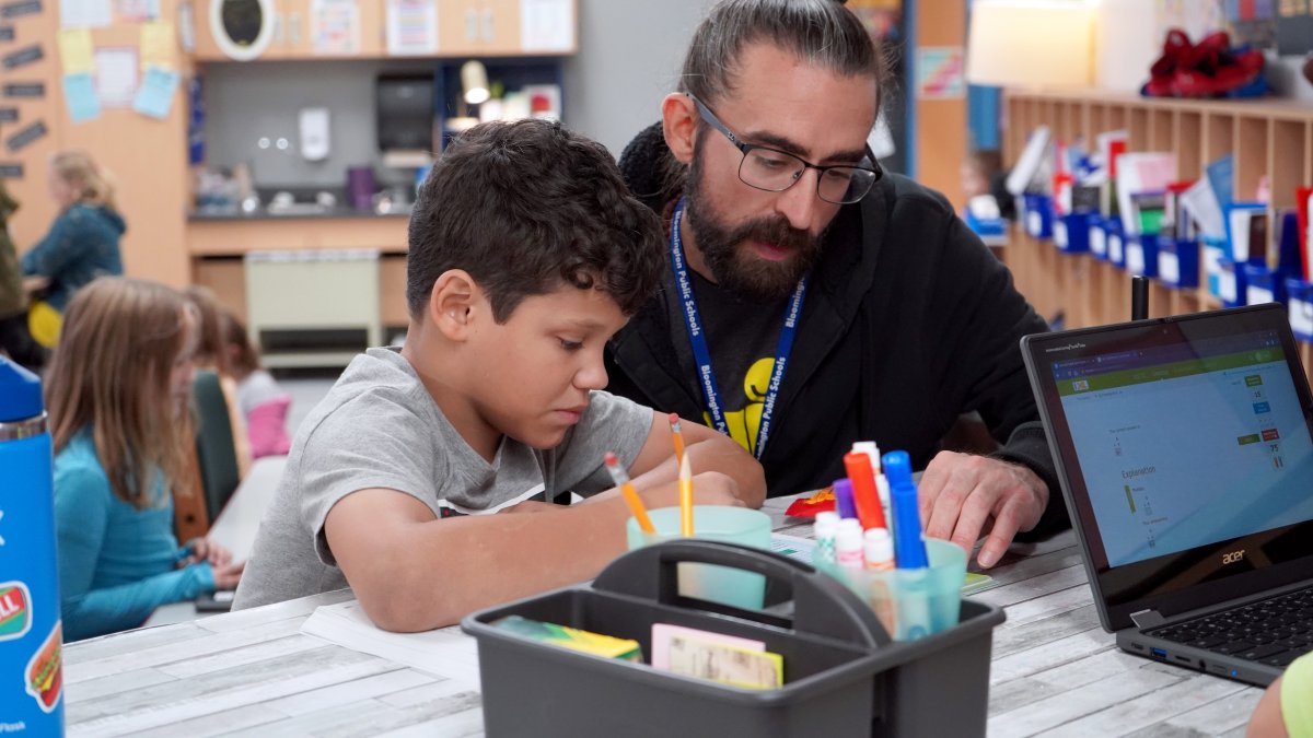 teacher working one on one with student