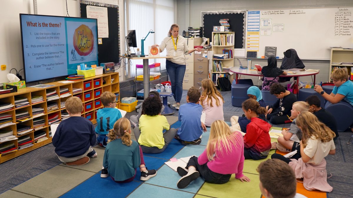 classroom of students listening to teacher