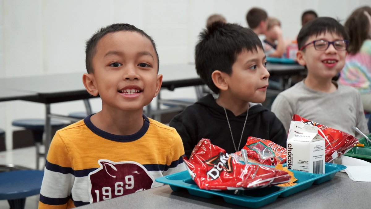 student with lunch tray