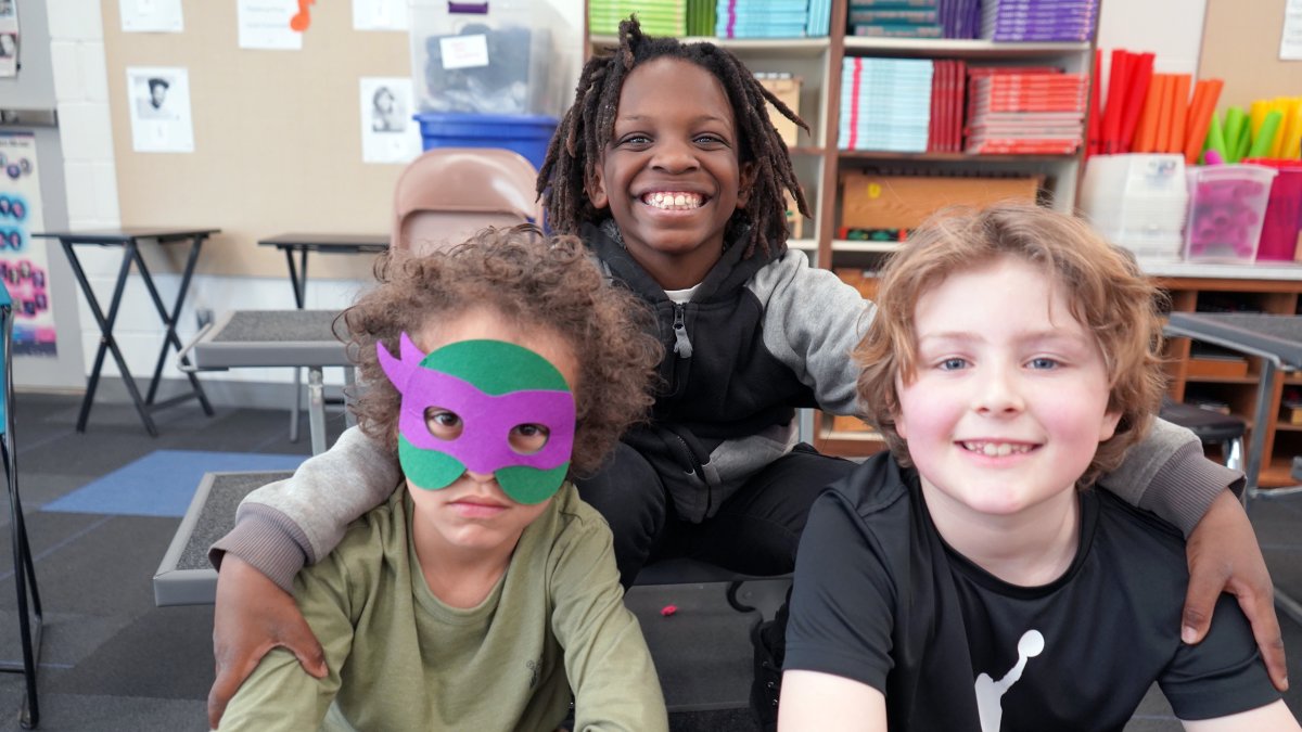 three students smiling