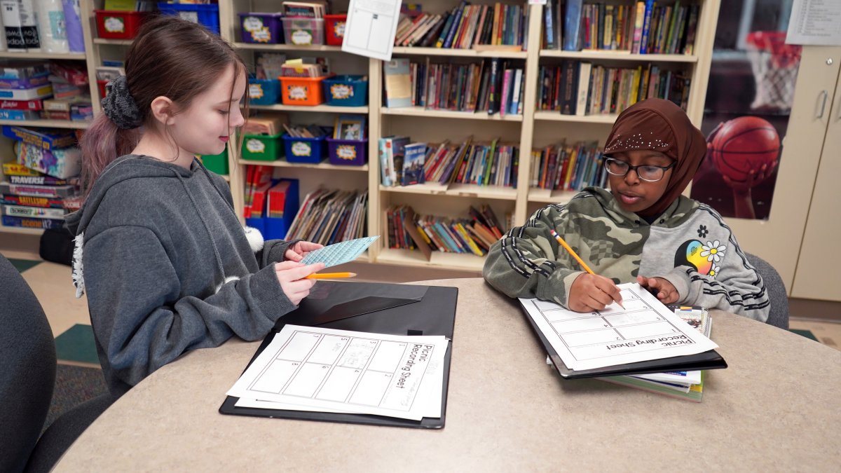 students writing on worksheets