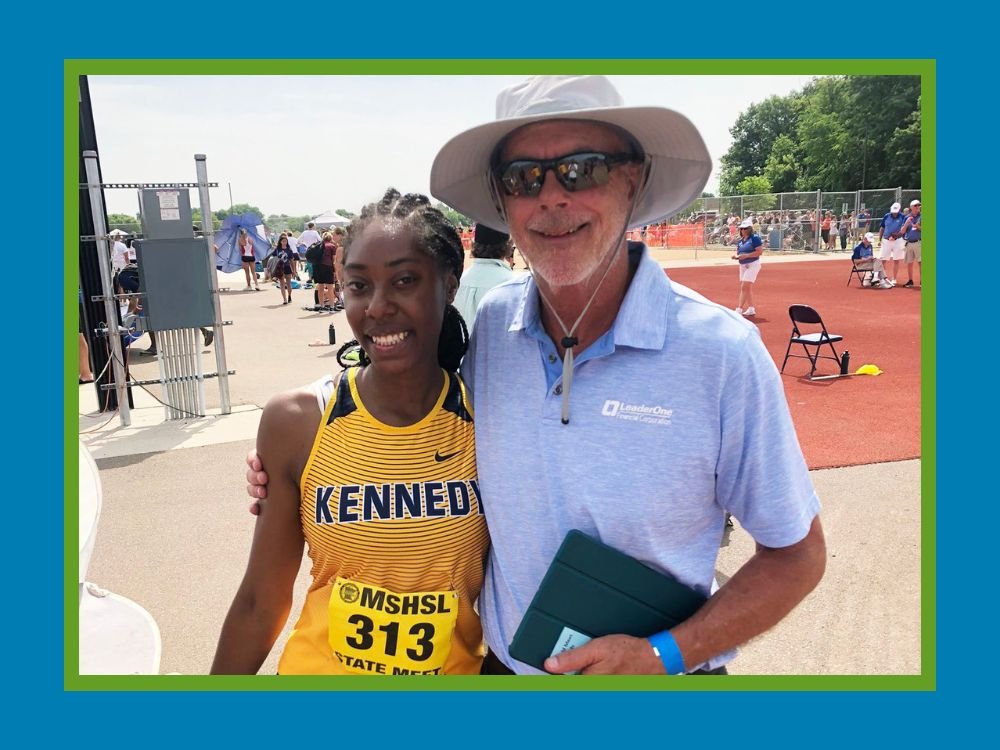 female Track and Field athlete with coach