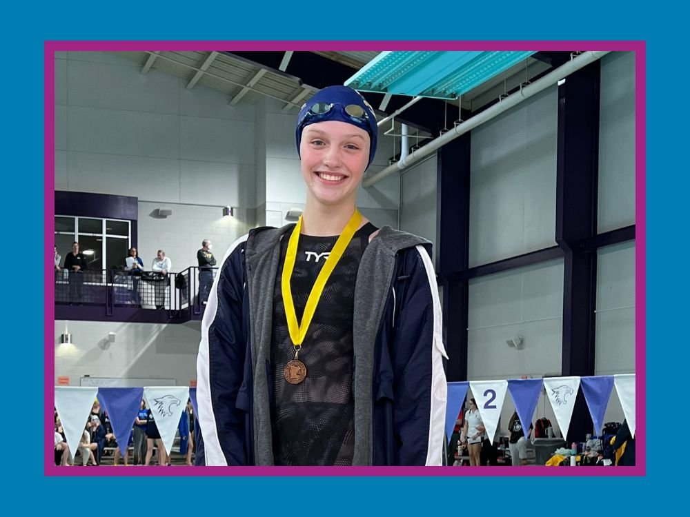 swimmer Kaylee Von Ruden wearing a medal
