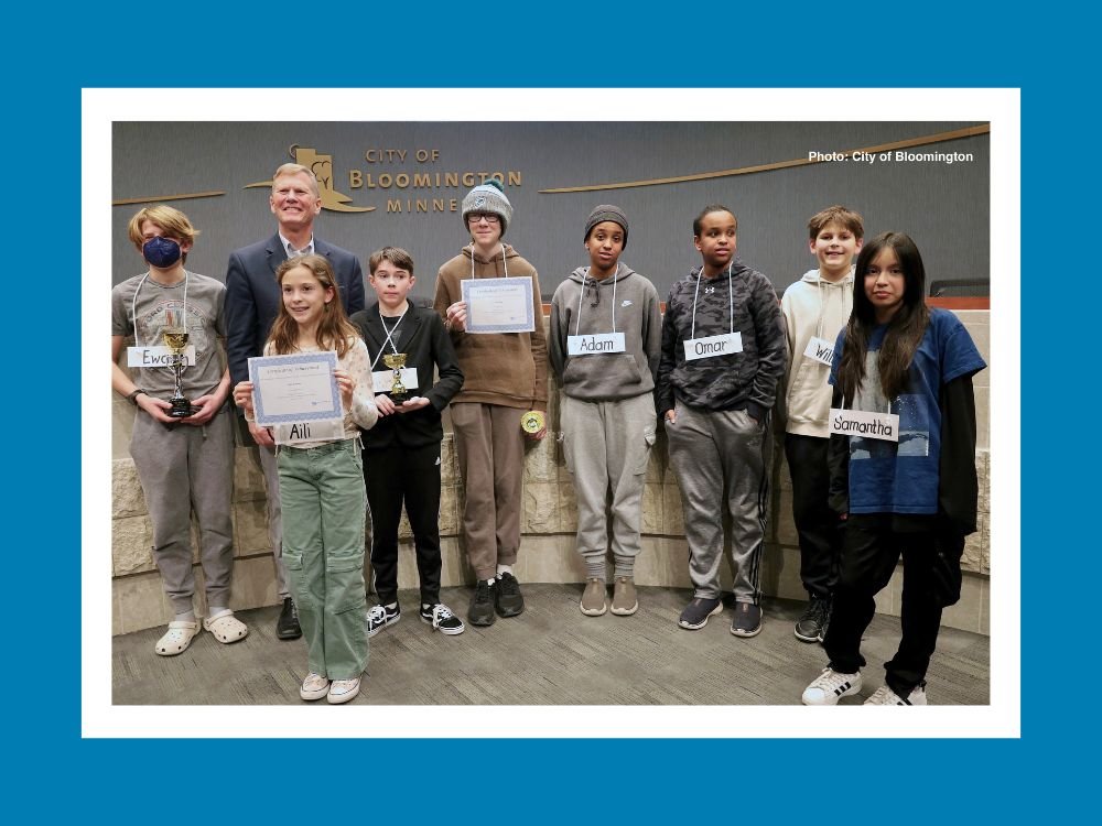 students standing with city mayor