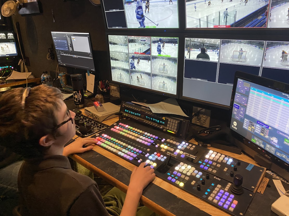 Student at control board for a video production